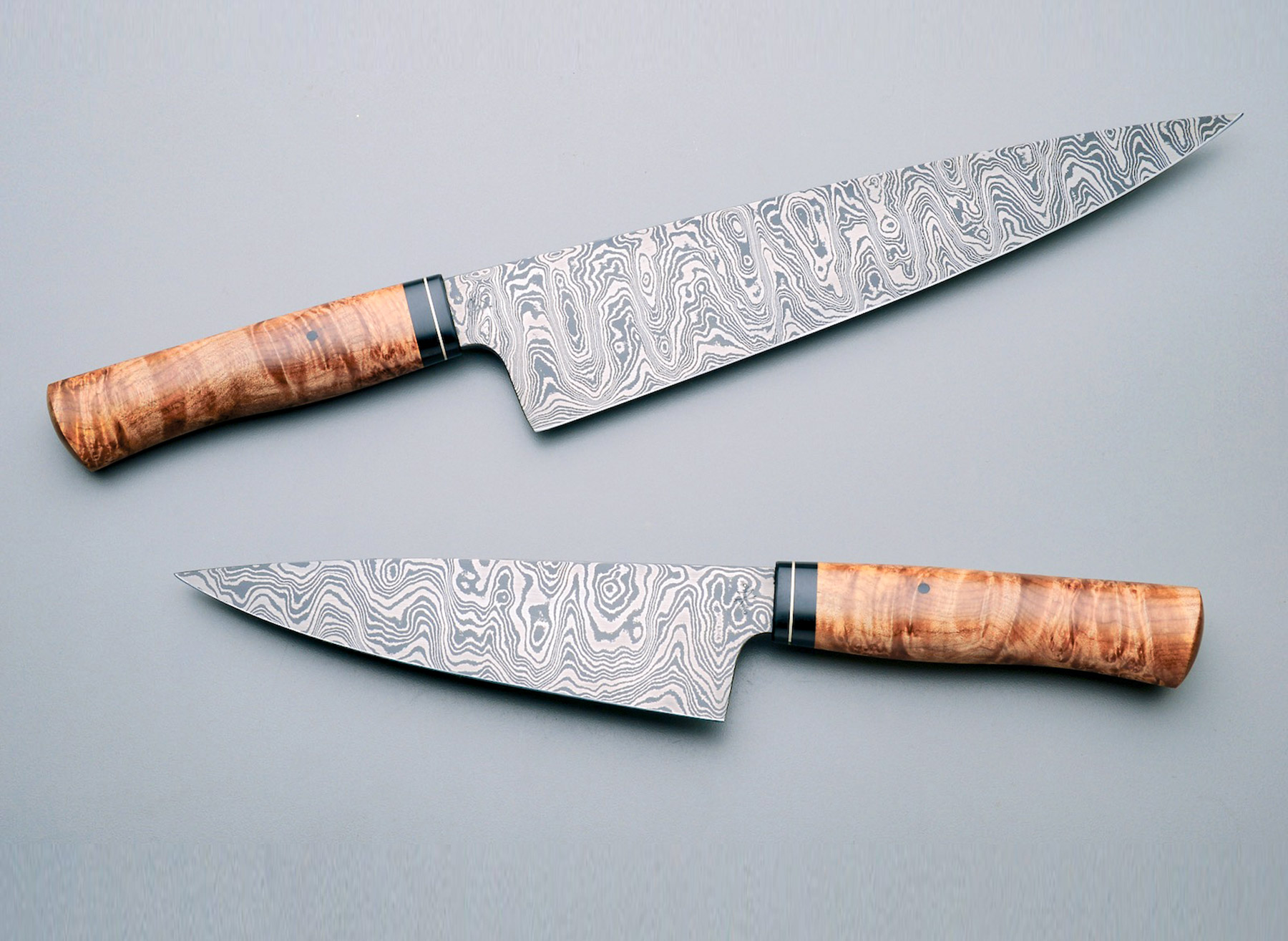 Was gifted this hand crafted chefs knife. 14” Damascus steel with